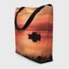 View from an angle of the large size Sunset By The Bay Tote Bag with inside pocket.
